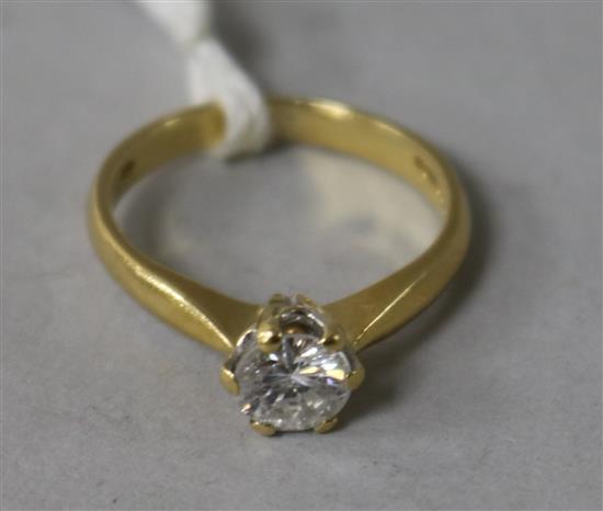 An 18ct gold and solitaire diamond ring, size K.